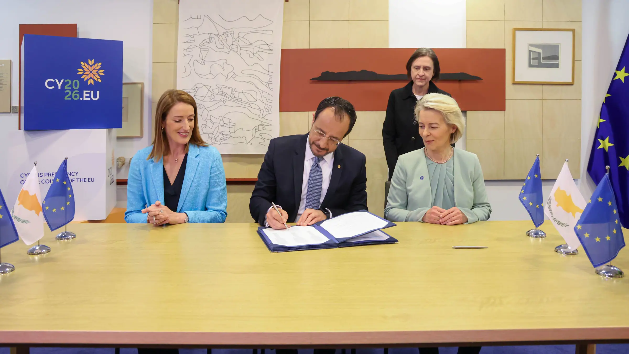 President Christodoulides signing an agreement