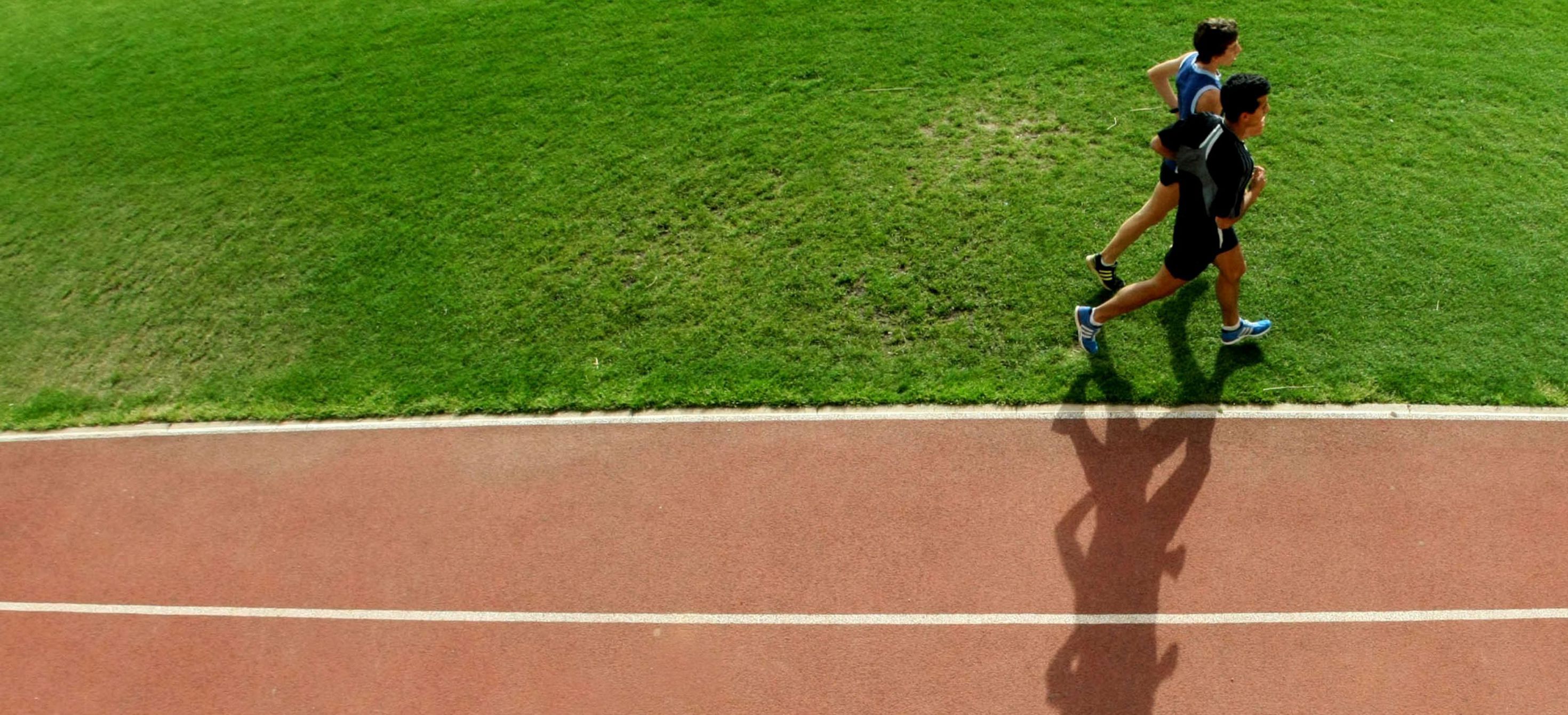 Two athletes running track