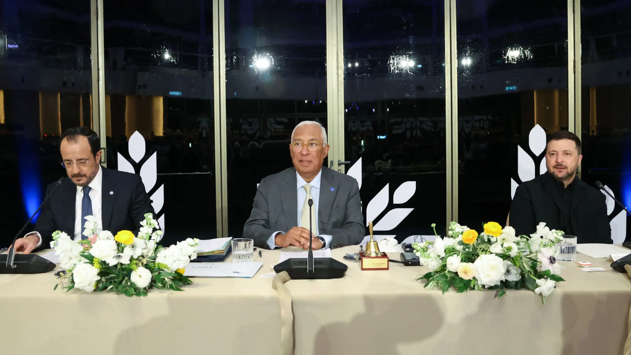 three men sitting in roundtable