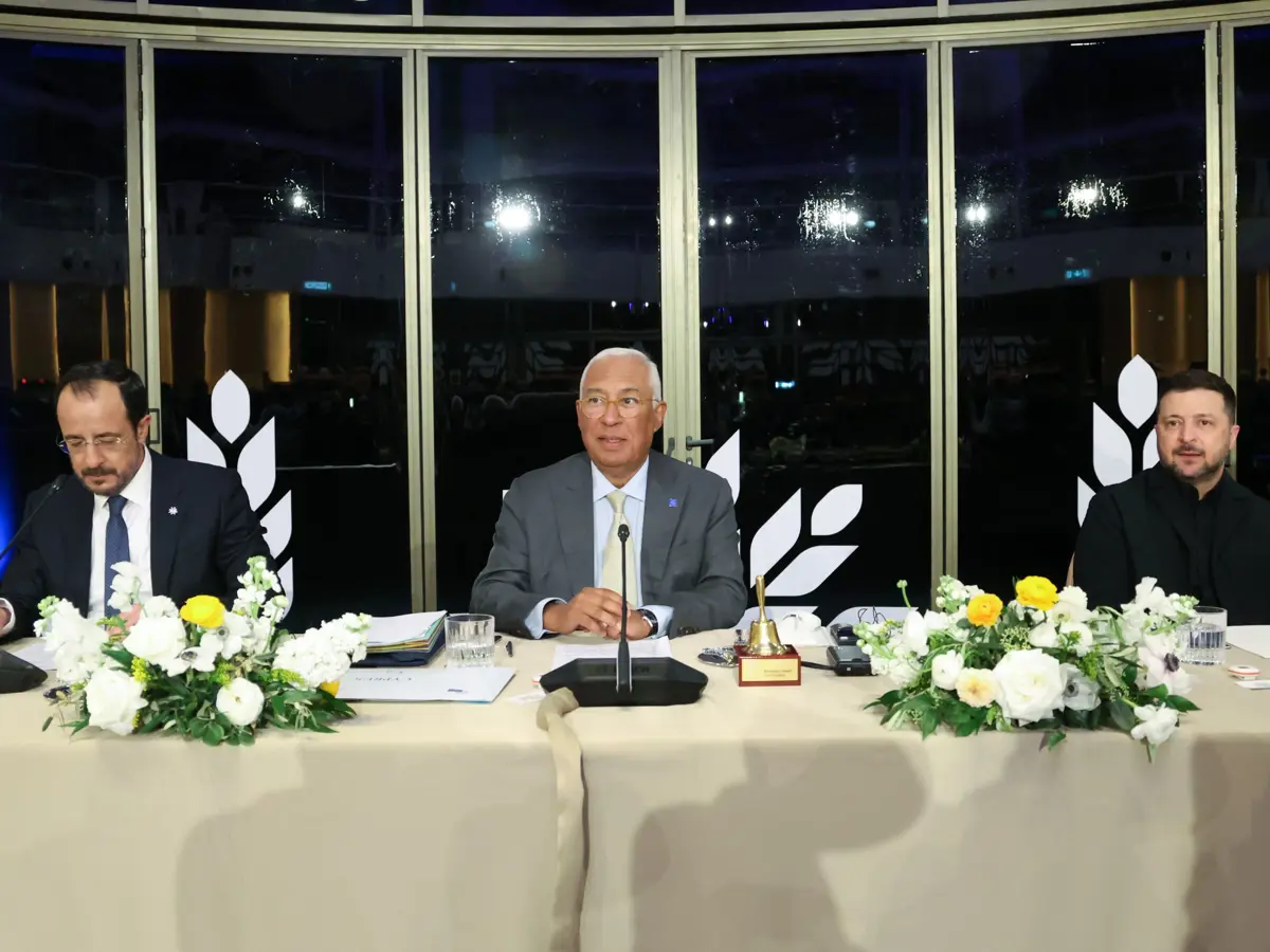 three men sitting in roundtable