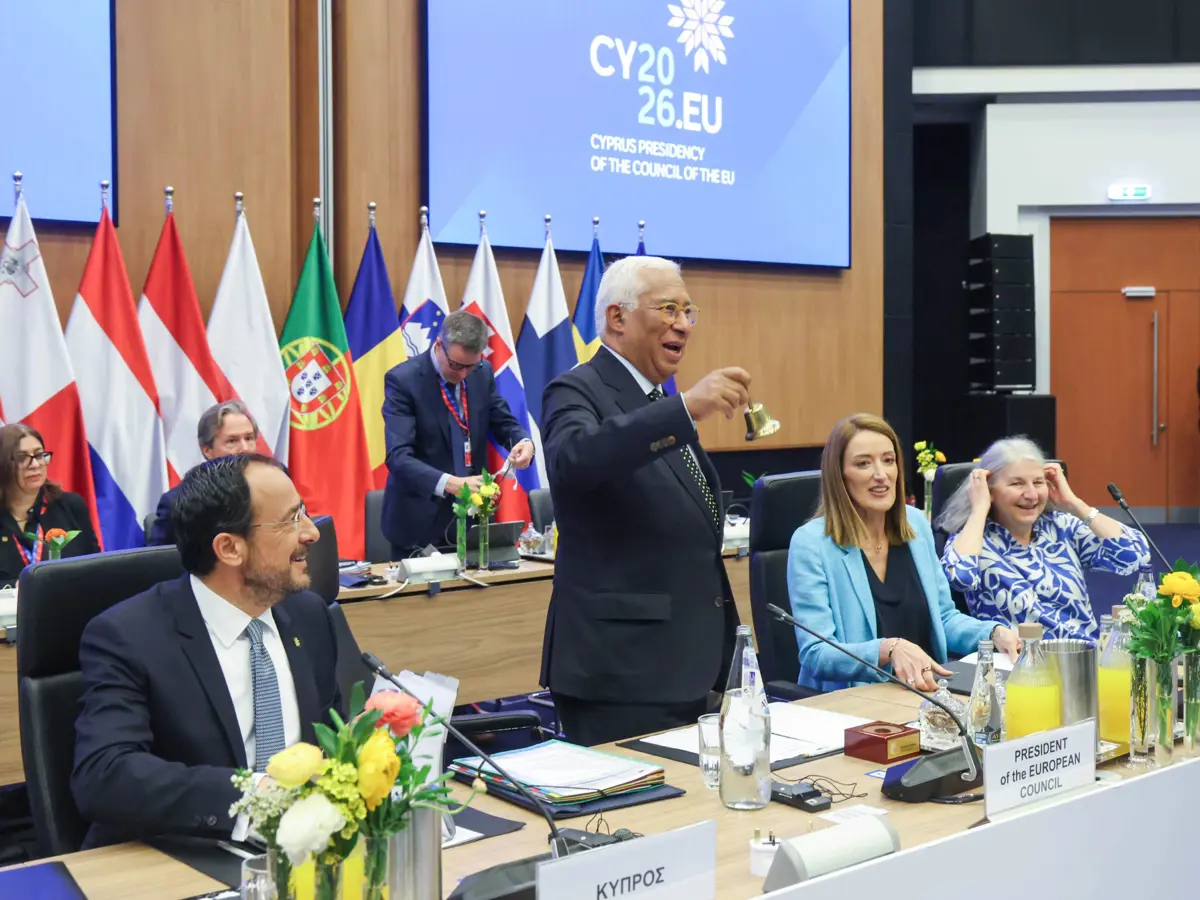 four people sitting on podium