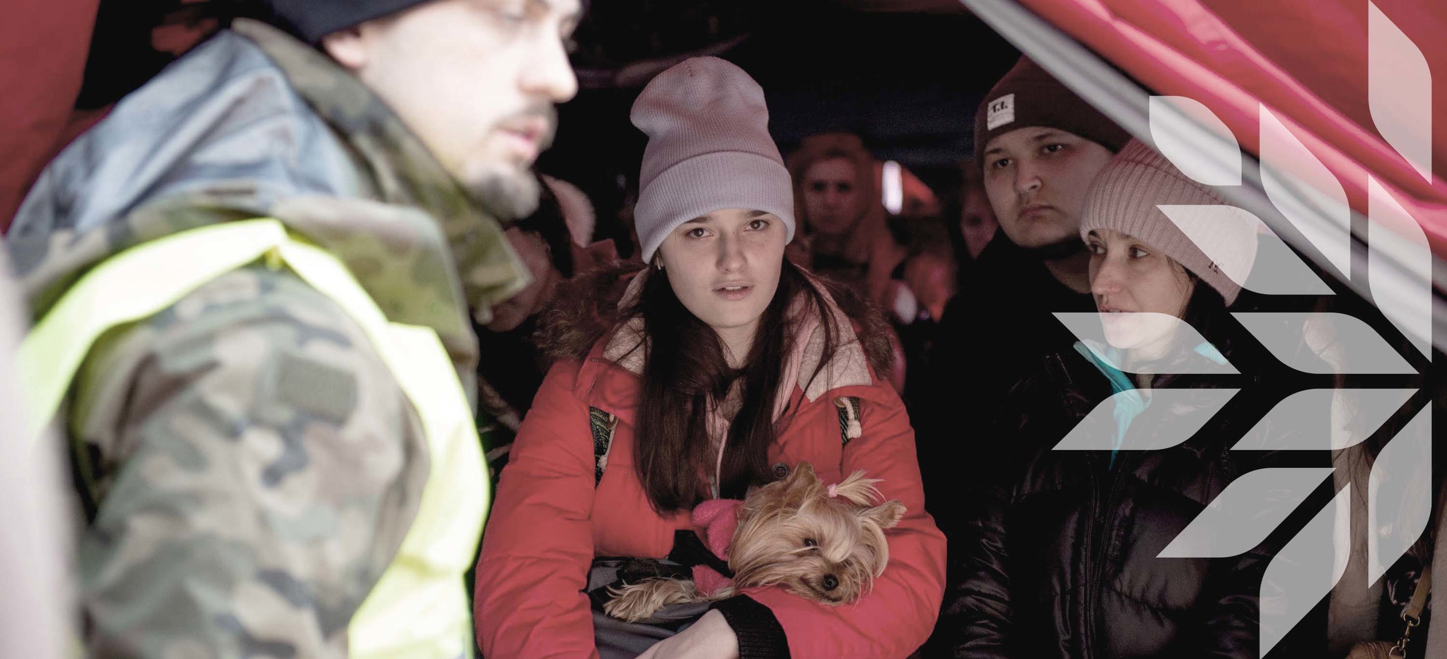 A Ukrainian refugee and her dog in a reception centre 
