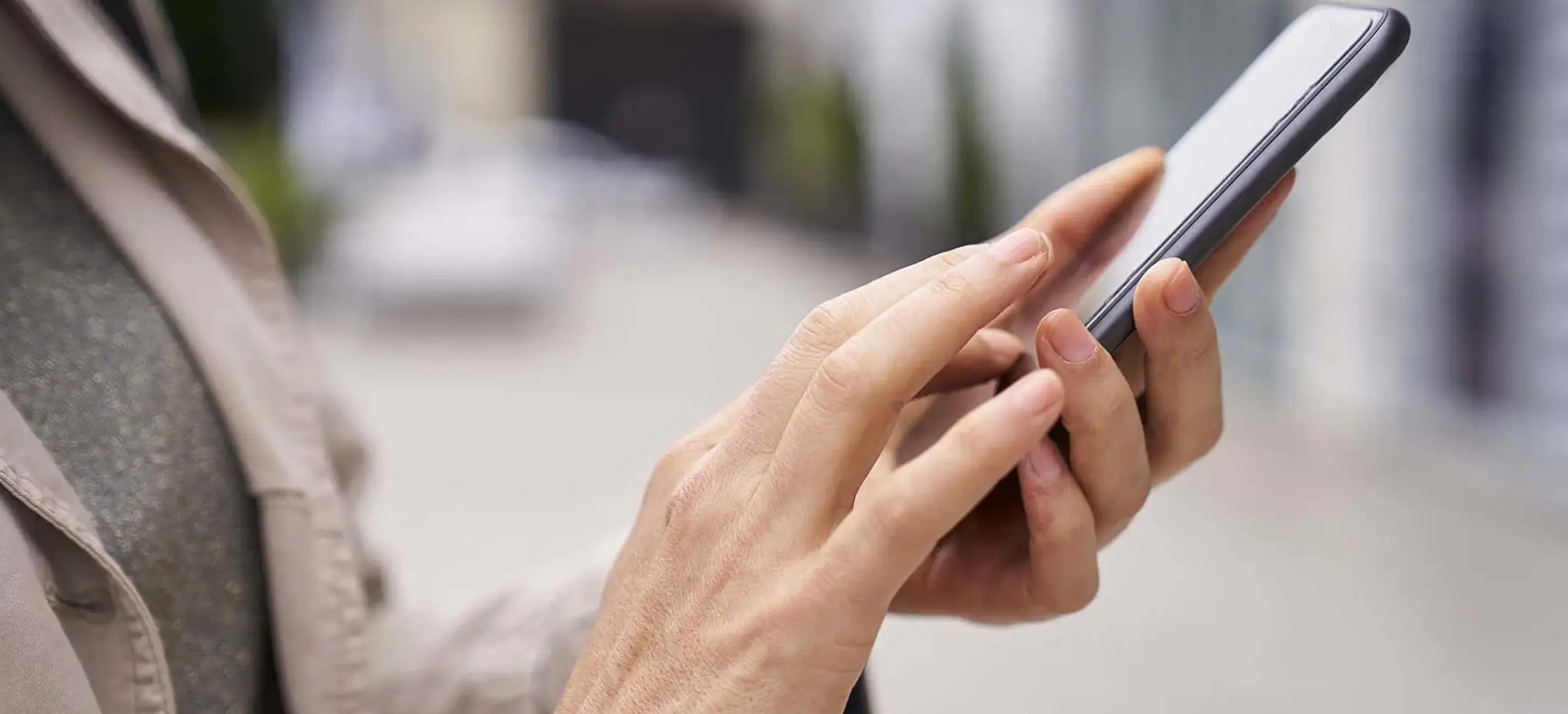 Close-up photo of hands holding a smartphone