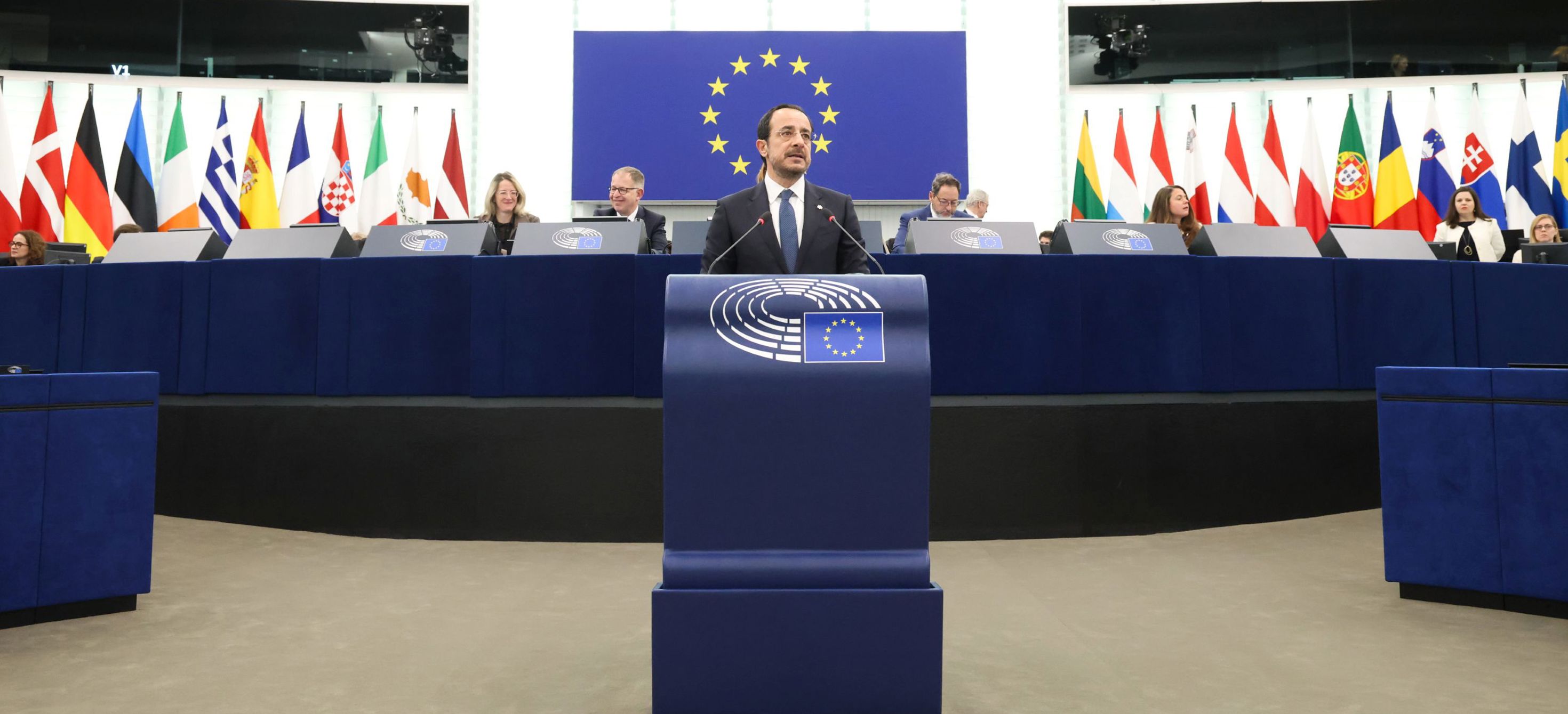 man speaking on podium