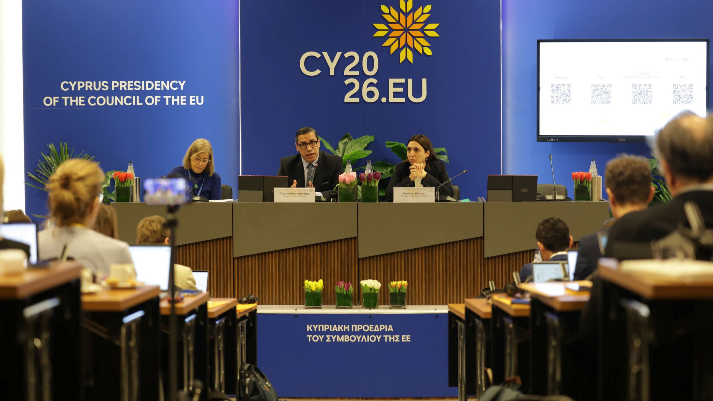 people sitting on panel speaking